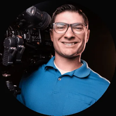 Adam, founder of Grab Your Assets, holding a cinema camera